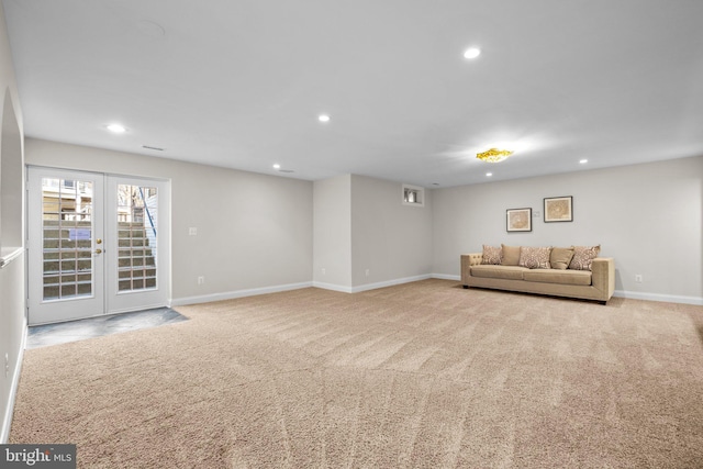 unfurnished living room with baseboards, carpet floors, french doors, and recessed lighting