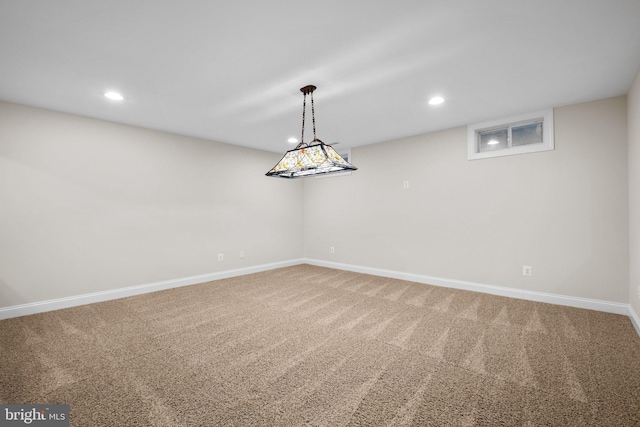 carpeted spare room featuring recessed lighting and baseboards