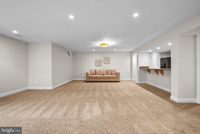 unfurnished room with light carpet and recessed lighting