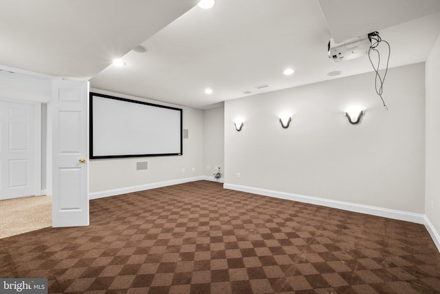 home theater featuring baseboards, dark carpet, and recessed lighting