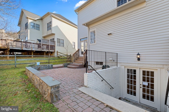 view of patio / terrace featuring french doors and fence