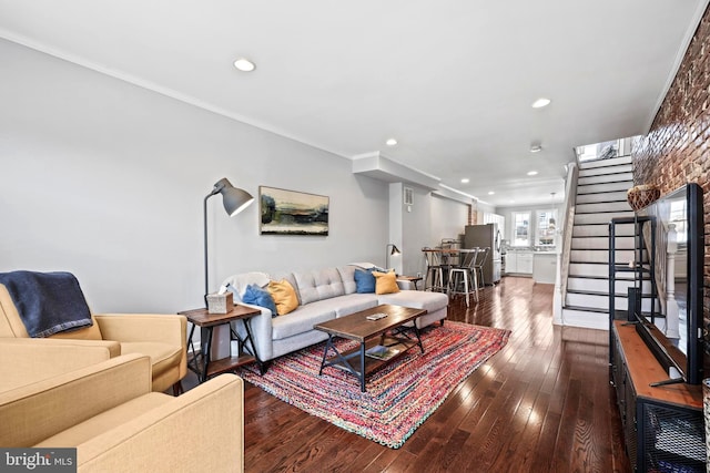 living room with recessed lighting, stairway, dark wood-type flooring, and ornamental molding