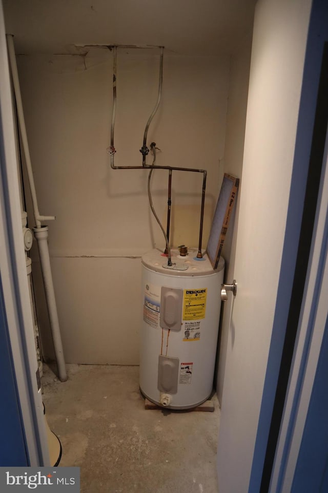 utility room with electric water heater