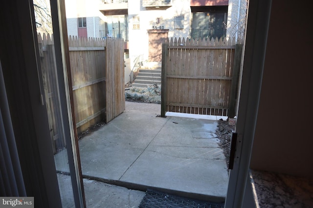 view of patio / terrace featuring fence