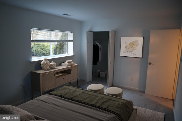 bedroom featuring visible vents, baseboards, a closet, and carpet flooring