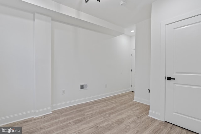 spare room featuring recessed lighting, light wood-type flooring, visible vents, and baseboards