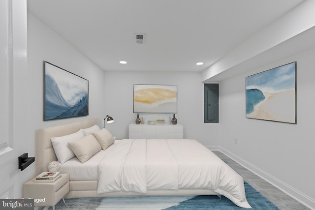 bedroom with visible vents, recessed lighting, electric panel, and baseboards