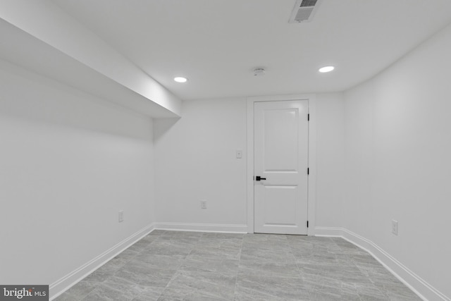 finished basement with recessed lighting, visible vents, and baseboards