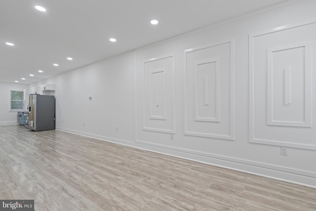 interior space with light wood-style floors, recessed lighting, and baseboards