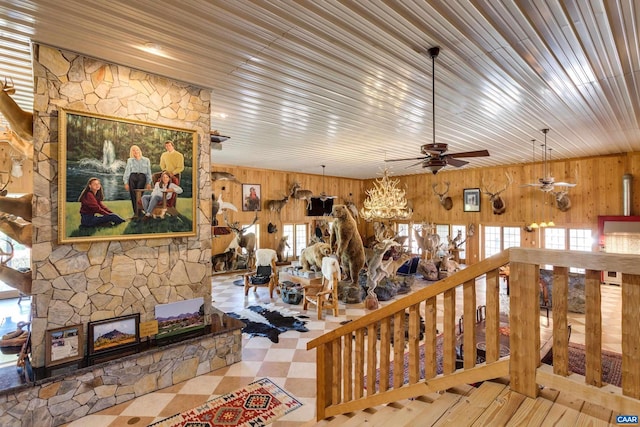 240 Stoneleigh Rd, Palmyra, VA 22963 - living area with wood walls, a ceiling fan, and a fireplace