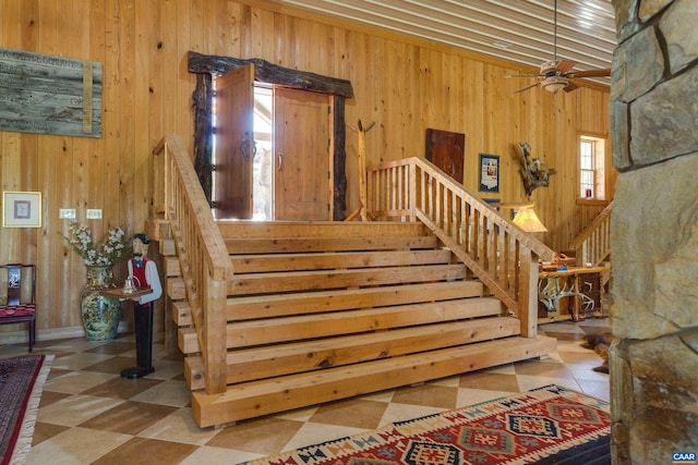 240 Stoneleigh Rd, Palmyra, VA 22963 - stairs featuring wood walls, a ceiling fan, and tile patterned floors