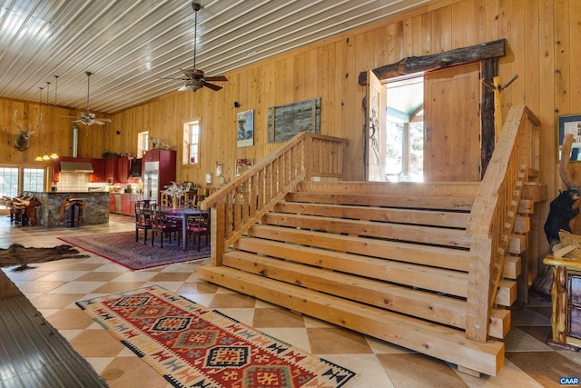 240 Stoneleigh Rd, Palmyra, VA 22963 - stairs featuring wood walls, healthy amount of natural light, a ceiling fan, and tile patterned floors