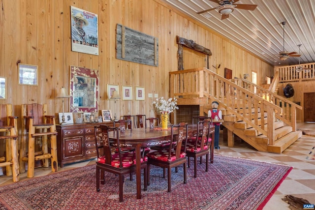 240 Stoneleigh Rd, Palmyra, VA 22963 - dining space with ceiling fan, wooden walls, stairway, tile patterned floors, and wooden ceiling
