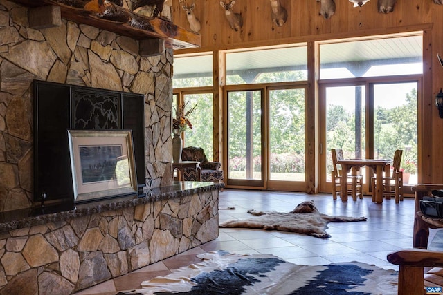 240 Stoneleigh Rd, Palmyra, VA 22963 - tiled living room with plenty of natural light and wood walls