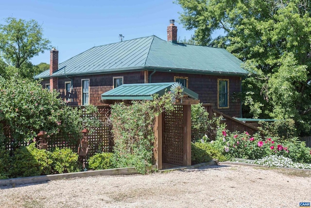 240 Stoneleigh Rd, Palmyra, VA 22963 - view of front of house featuring a chimney, a standing seam roof, and metal roof