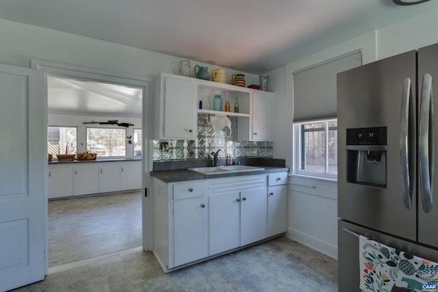 240 Stoneleigh Rd, Palmyra, VA 22963 - kitchen featuring stainless steel refrigerator with ice dispenser, a sink, dark countertops, open shelves, and white cabinetry