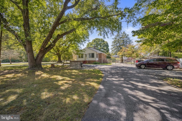 view of front of house featuring fence