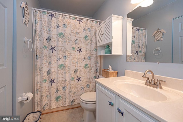 full bathroom featuring curtained shower, toilet, vanity, and tile patterned flooring