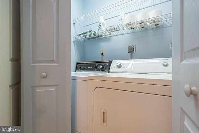 clothes washing area featuring laundry area and independent washer and dryer