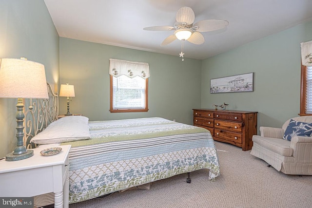 carpeted bedroom featuring a ceiling fan