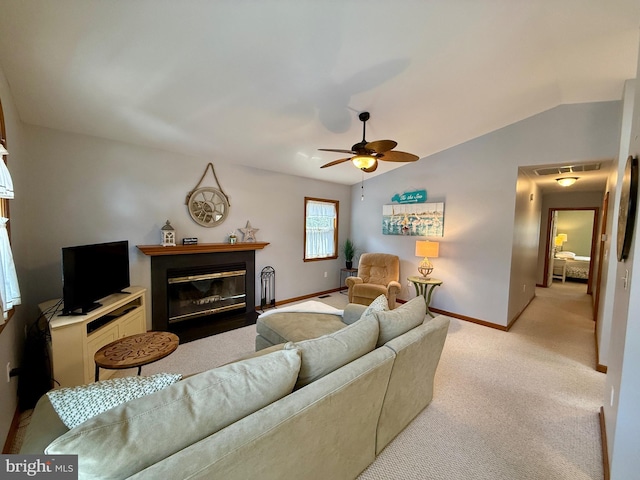 living room featuring visible vents, light colored carpet, a fireplace with flush hearth, and vaulted ceiling