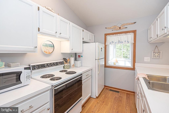 kitchen featuring visible vents, white appliances, white cabinets, and light countertops