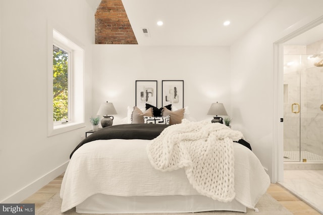 bedroom with connected bathroom, recessed lighting, wood finished floors, visible vents, and baseboards