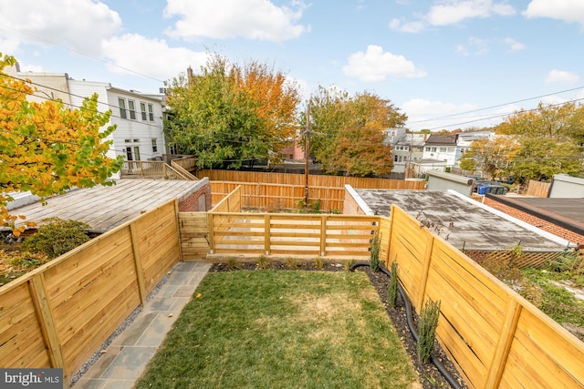 view of yard with a fenced backyard