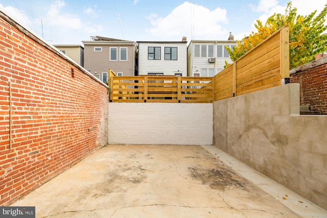 view of patio / terrace featuring fence