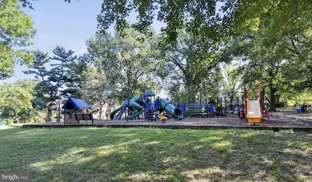 community jungle gym with a yard