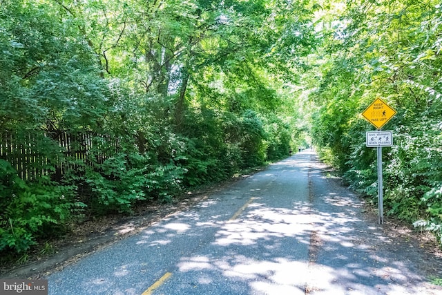 view of street with a wooded view