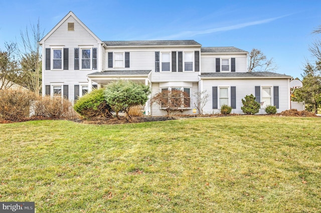 view of front of home with a front lawn