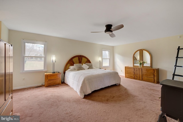 bedroom with baseboards, carpet floors, and ceiling fan