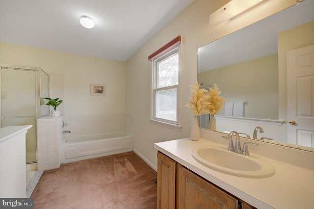 full bath featuring vanity, a shower stall, and a bath