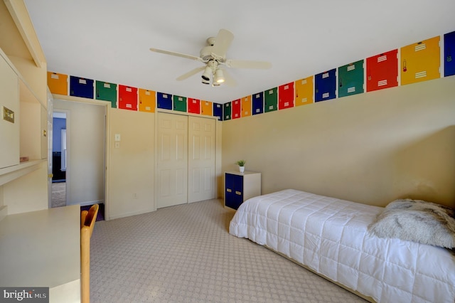 bedroom with a closet, carpet floors, and a ceiling fan