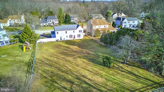 aerial view featuring a residential view and a view of trees