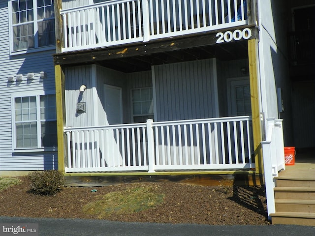 view of side of home featuring a balcony