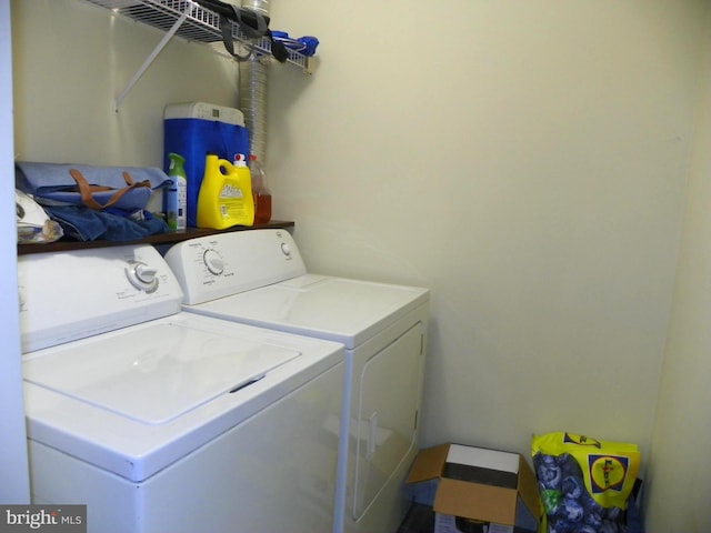 laundry area featuring laundry area and washing machine and clothes dryer