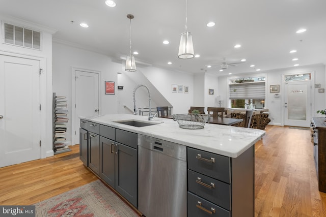 kitchen with visible vents, crown molding, decorative light fixtures, dishwasher, and a sink