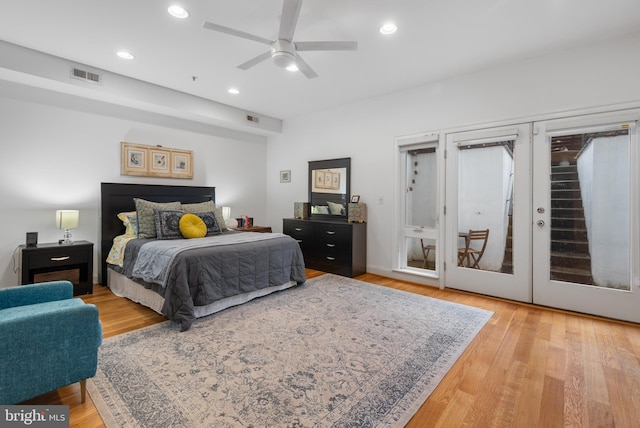 bedroom featuring recessed lighting, visible vents, wood finished floors, and french doors