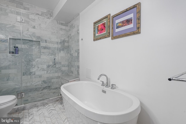 full bathroom featuring a soaking tub, toilet, and a stall shower