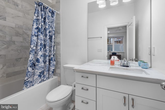 bathroom with vanity, toilet, and shower / bath combo with shower curtain