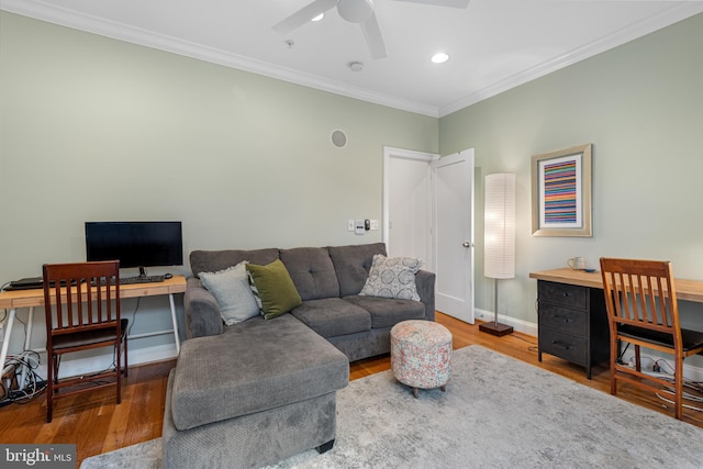 living area featuring crown molding, baseboards, recessed lighting, wood finished floors, and a ceiling fan