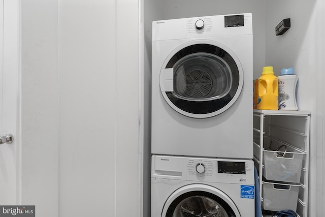 laundry room featuring stacked washer and clothes dryer and laundry area