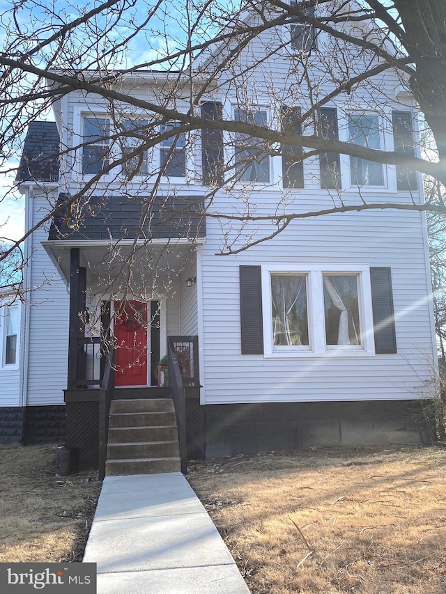 view of front of house featuring a chimney