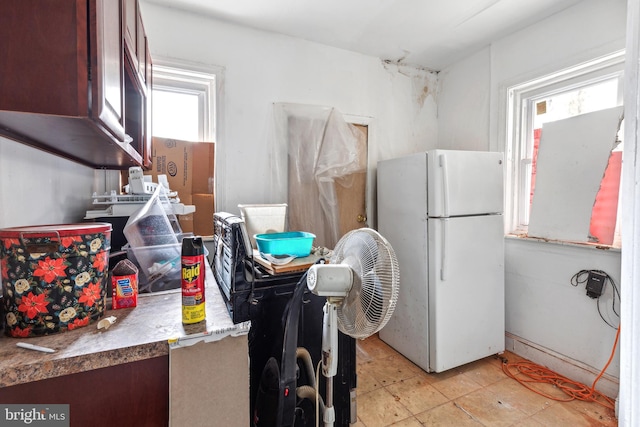 kitchen with freestanding refrigerator