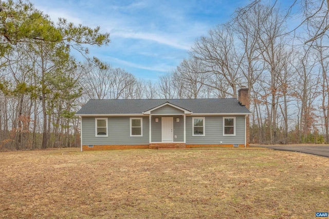 ranch-style house featuring a shingled roof, a front yard, a chimney, and crawl space