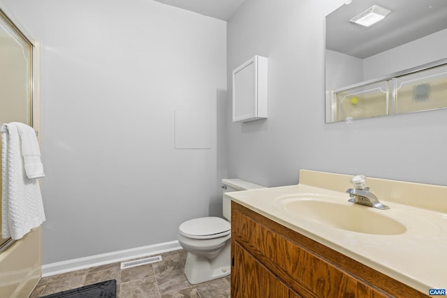 bathroom with vanity, baseboards, visible vents, toilet, and a shower with door