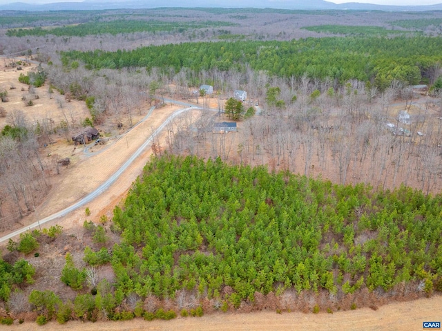 aerial view featuring a wooded view