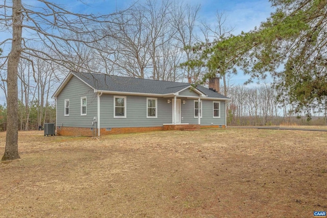 ranch-style home featuring crawl space, roof with shingles, central AC unit, and a chimney